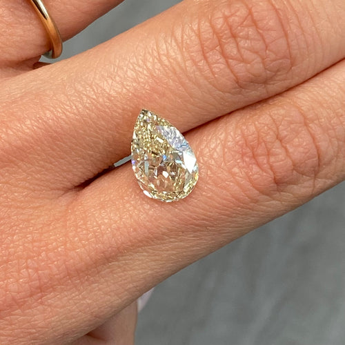 Light yellow pear-shaped diamond with VS1 clarity, excellent cut, and GIA certified.