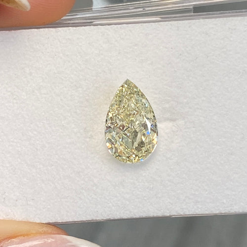 Light yellow pear-shaped diamond with VS1 clarity, excellent cut, and GIA certified.