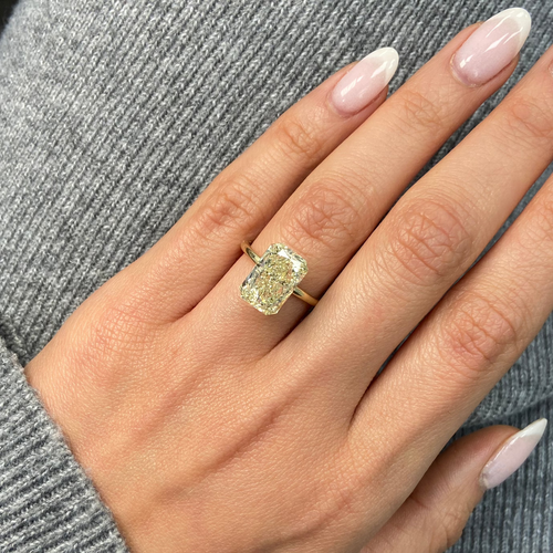 Light yellow radiant cut diamond with VS1 clarity, excellent cut, GIA certified.