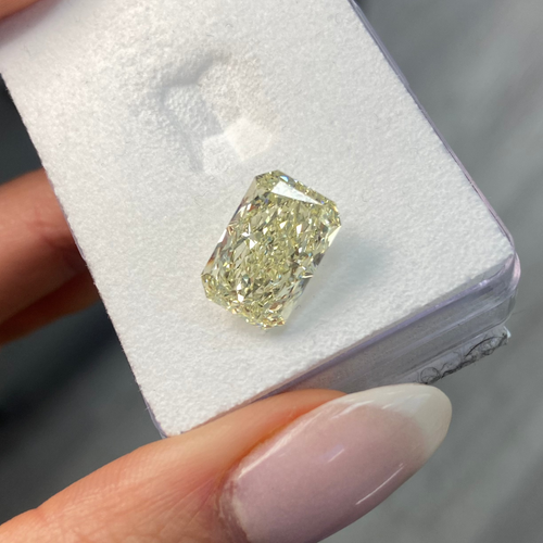 Light yellow radiant cut diamond with VS1 clarity, excellent cut, GIA certified.