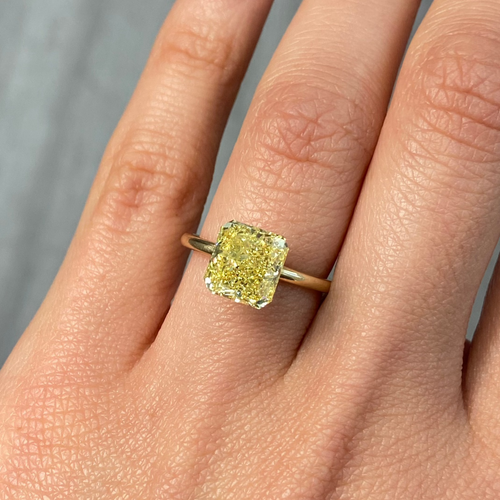 Fancy intense yellow radiant cut diamond with VS1 clarity, excellent cut, GIA certified.