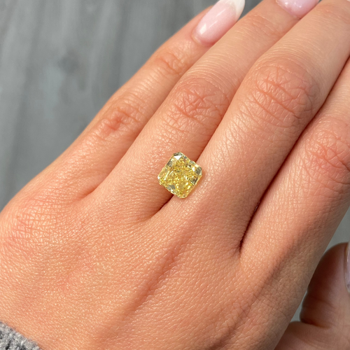 Fancy intense yellow radiant cut diamond with VS1 clarity, excellent cut, GIA certified.