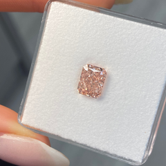 GIA certified fancy brown-pink elongated radiant diamond with VS1 clarity and no fluorescence.