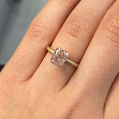 GIA certified fancy brown-pink elongated radiant diamond with VS1 clarity and no fluorescence.