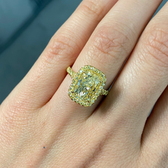 GIA certified light yellow elongated cushion cut diamond ring with canary yellow and golden yellow diamonds, SI1 clarity.