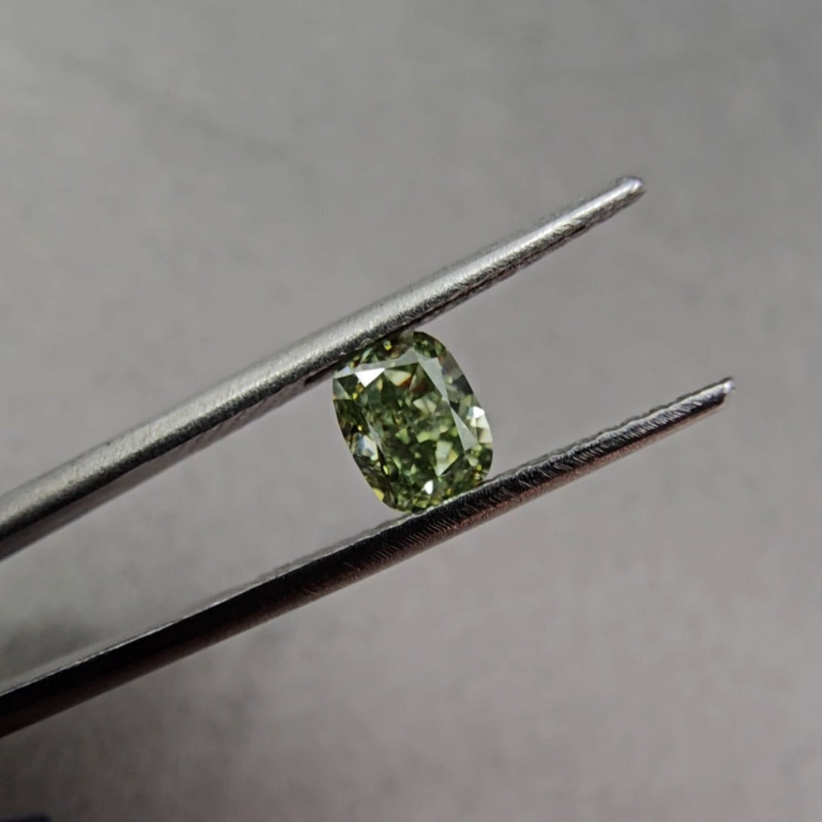 0.66 Carat GIA Fancy Intense Yellowish-Green Cushion Cut Diamond VS2 Clarity Super Saturated Deep Green GIA Certified Diamond