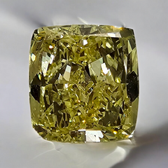 GIA certified fancy light yellow elongated cushion cut diamond with VVS2 clarity.