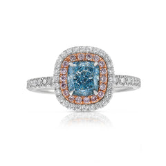 natural blue diamond ring, with blue cushion cut diamond surrounded by pink and white diamonds in a double halo ring design