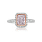 Pink diamond engagement ring surrounded by a white diamond halo
