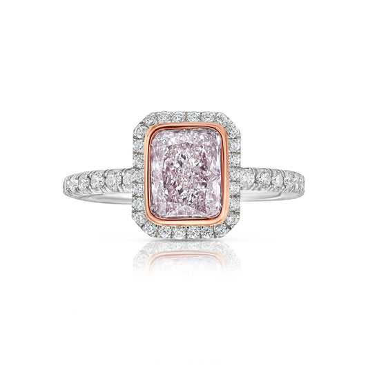 Pink diamond engagement ring surrounded by a white diamond halo