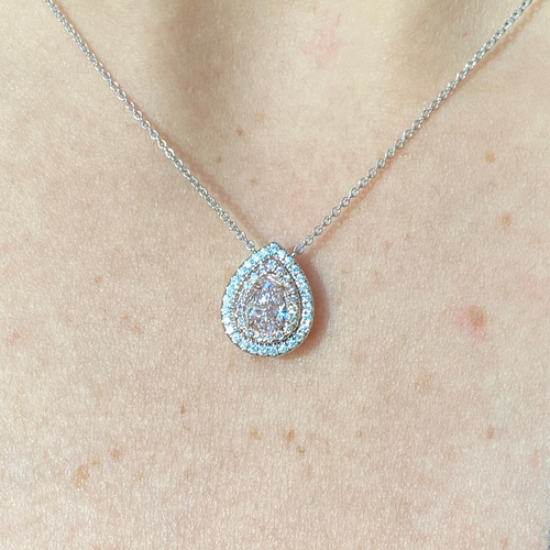 Ethereal pink pear-shaped diamond pendant with double halo featuring a GIA-certified faint pink center diamond with a VS2 clarity.