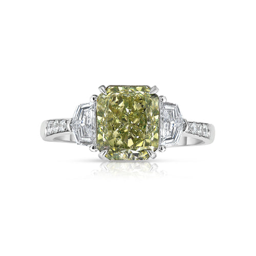 Green diamond three stone engagement ring with natural green radiant cut diamond.