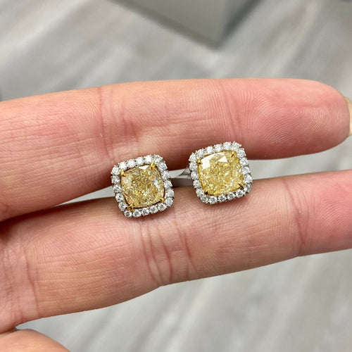 yellow diamond earrings. yellow diamond studs. yellow diamond halo studs. cushion cut yellow diamonds,