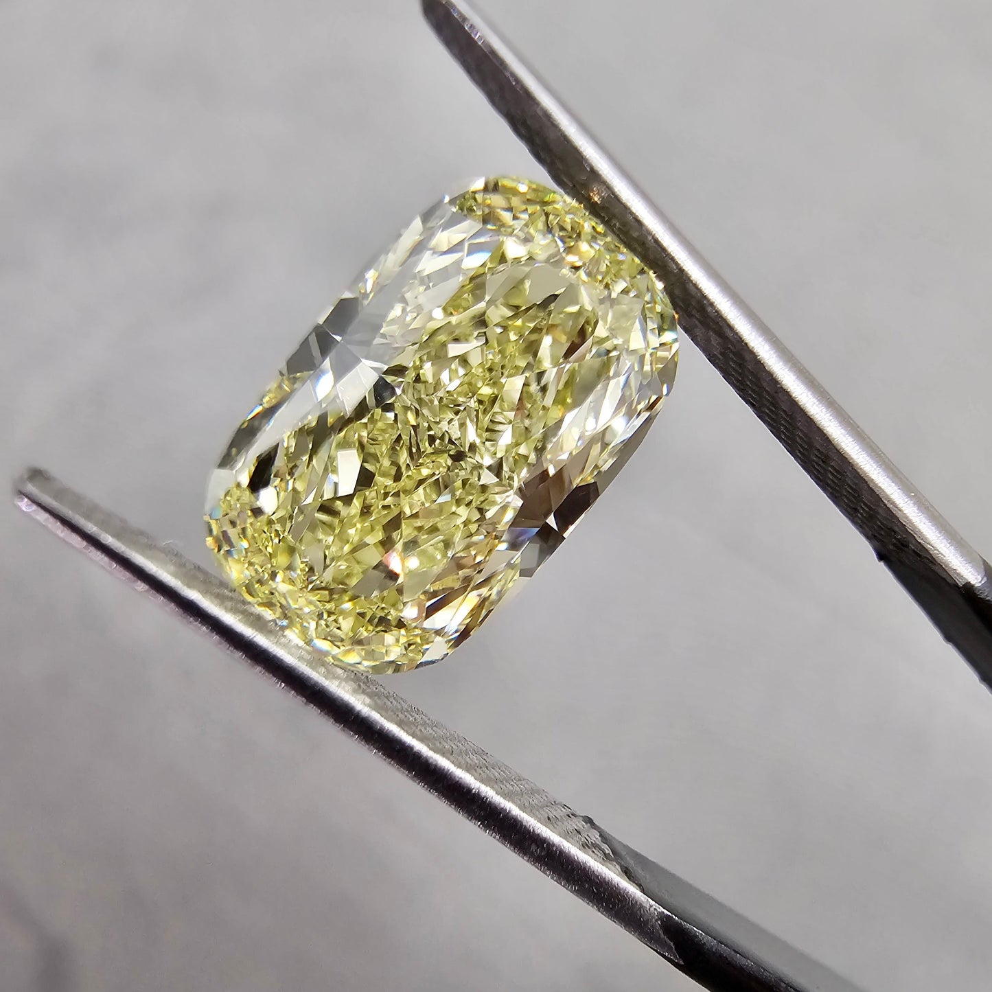 Elongated fancy yellow diamond cushion cut. Long fancy yellow diamond cushion cut. yellow diamond cushion. 5 carat fancy yellow.