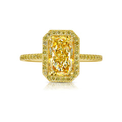 Elongated natural yellow diamond ring featuring a GIA-certified light yellow radiant diamond.