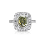 Unique style green diamond ring surrounded by white diamonds handmade in white gold.