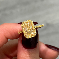 Elongated yellow diamond ring