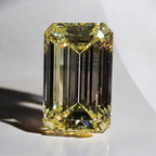 Unique elongated light yellow emerald cut diamond, GIA certified with excellent clarity.