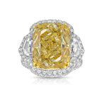 13.30 carat yellow diamond on the center with white surrounding diamonds.