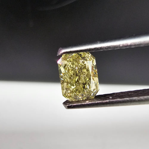 0.51 Carat Radiant Cut GIA Certified Diamond  Fancy Yellow  VS1 Clarity.