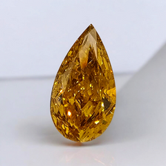 Unique Radiant Orange-Yellow Pear Shaped Diamond.