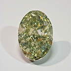 Oval-shaped green diamond on a light gray background