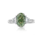 Elegant three-stone ring featuring a greenish-yellow oval diamond with GIA certified SI1 clarity.