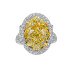 Yellow Oval Diamond Halo Ring with a handcrafted setting and GIA certified side diamonds.