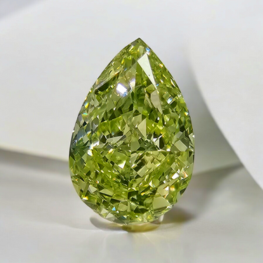 Fancy Light Green-Yellow pear-shaped diamond with VS2 clarity and a stunning hue.