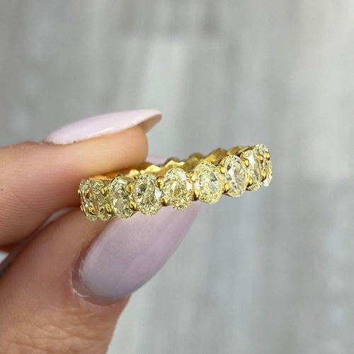 fancy yellow Oval diamond eternity ring. Yellow diamond oval eternity ring. Yellow diamond band. Canary diamond band. Yellow oval diamonds. Fancy yellow oval diamond ring. Yellow diamond stackable rings.