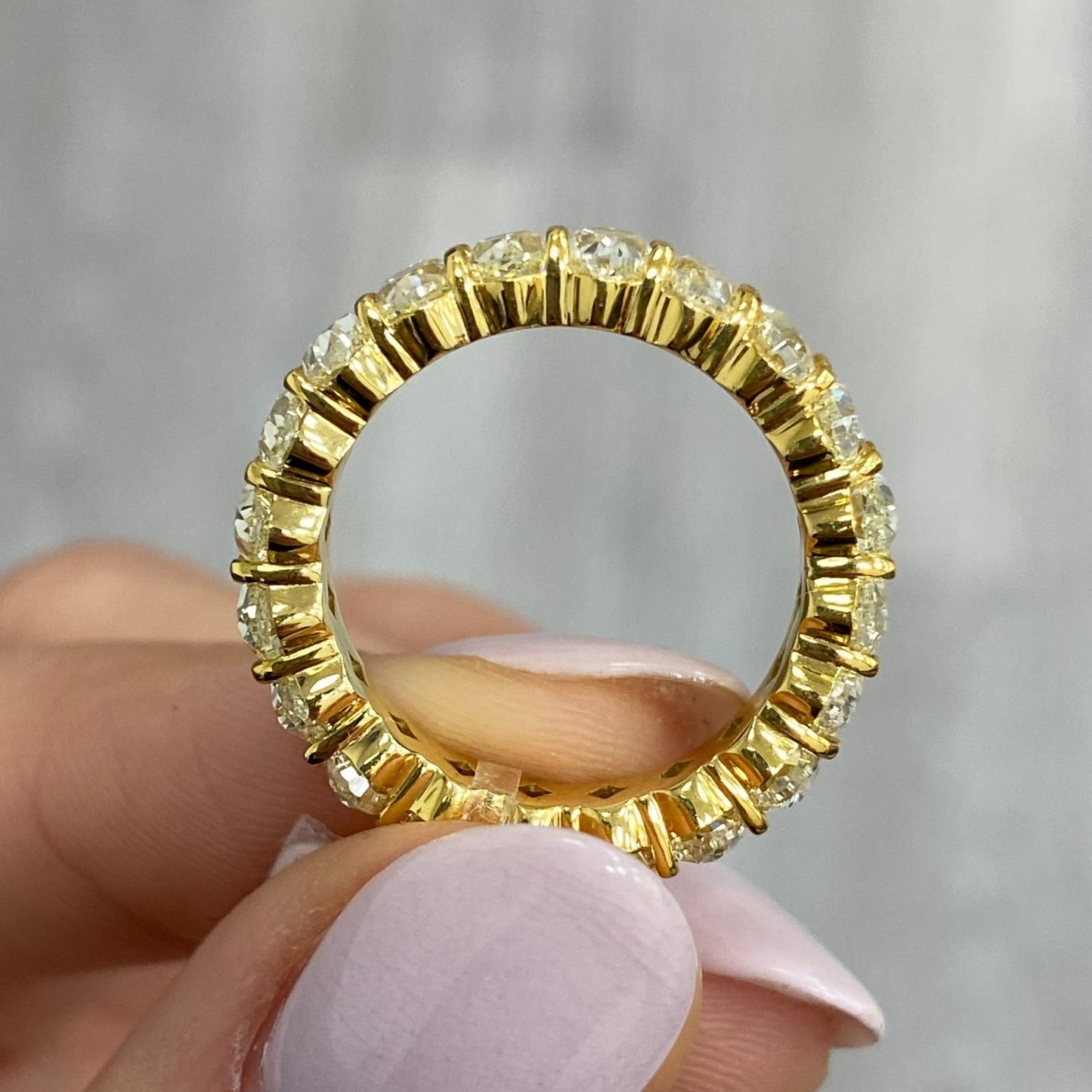 fancy yellow Oval diamond eternity ring. Yellow diamond oval eternity ring. Yellow diamond band. Canary diamond band. Yellow oval diamonds. Fancy yellow oval diamond ring. Yellow diamond stackable rings.