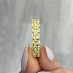 fancy yellow Oval diamond eternity ring. Yellow diamond oval eternity ring. Yellow diamond band. Canary diamond band. Yellow oval diamonds. Fancy yellow oval diamond ring. Yellow diamond stackable rings.