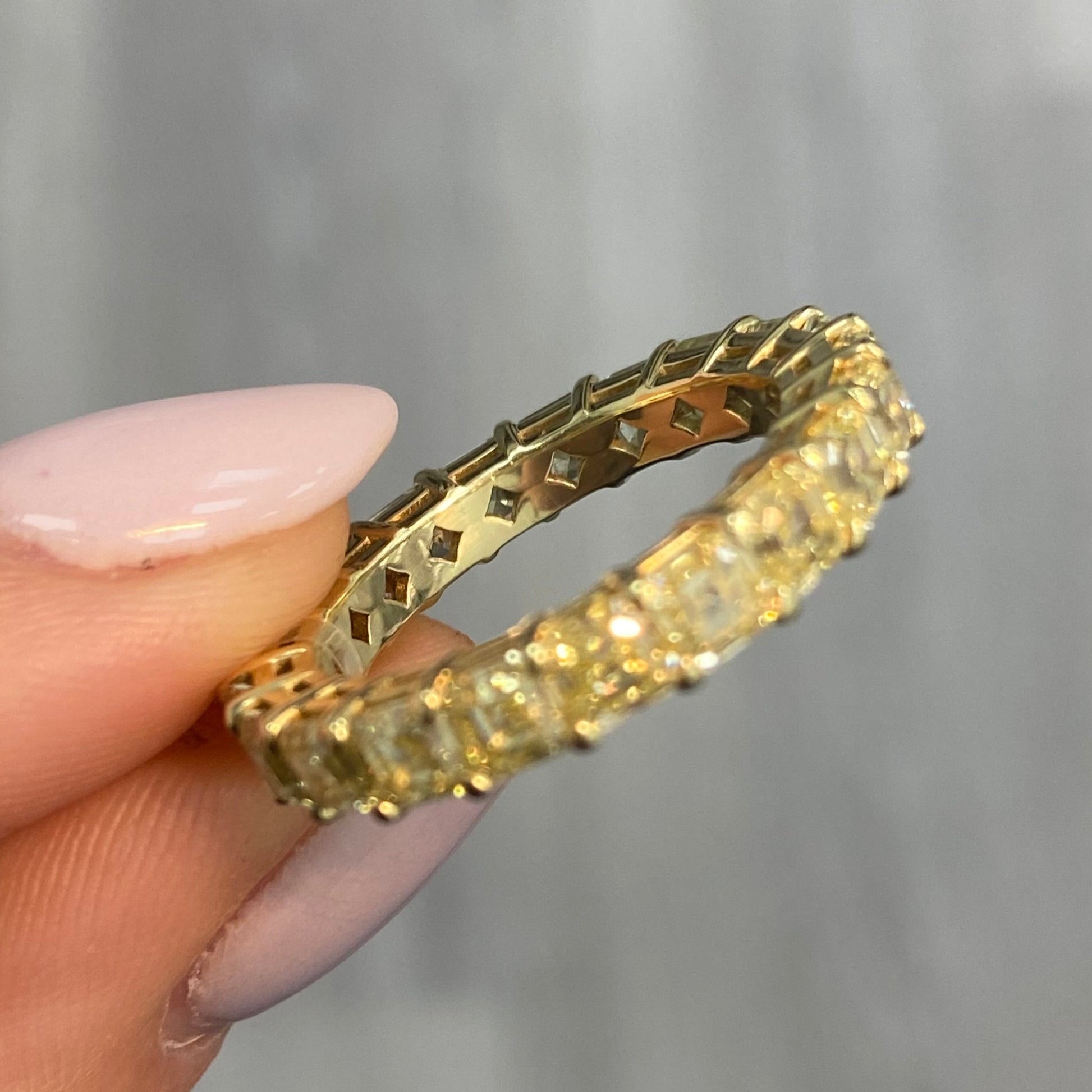 Fancy yellow diamond asscher cut eternity band.asscher cut diamonds. yellow asscher cut diamonds. Diamond eternity ring. Diamond wedding band. Yellow diamond jewelry.