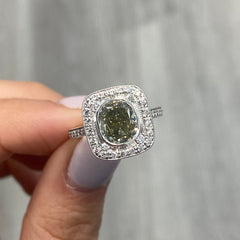 unique style green diamond ring surrounded by white diamonds handmade in white gold