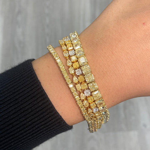 Fancy intense yellow diamond tennis bracelet with natural canary diamonds