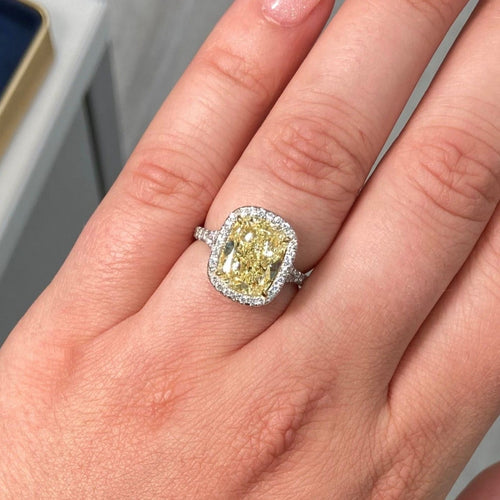 4.73 Carat Center Diamond GIA Light Yellow VS2 Clarity  Cushion Cut Diamond  0.52 Carats of White Rounds  Set in Platinum and 18k Gold  Split Shank band  Handmade in NYC GIA Certified Diamond 