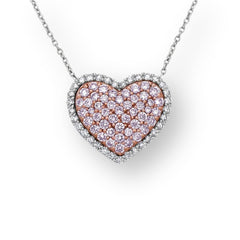 Pink diamond heart shape necklace with natural fancy pink and white diamonds in a diamond halo.