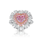 Pink heart shape diamond with white and pink surrounding diamonds.