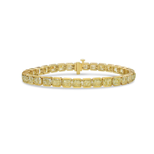 Fancy Yellow radiant cut diamond tennis bracelet with bezel-set diamonds in a sleek design with a SI and VS clarity.