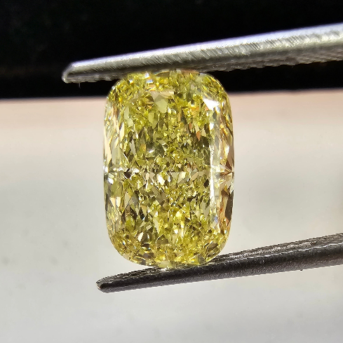 3 Carat Fancy yellow elongated cushion cut diamond.