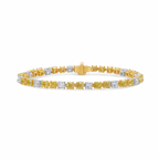 Fancy tennis bracelet with alternating yellow and white cushion cut diamonds.