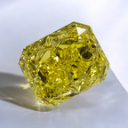 Unique GIA certified fancy vivid yellow elongated radiant cut diamond with flawless clarity.