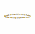 Luxurious bracelet pear-shaped fancy yellow and white diamonds in an elegant design.