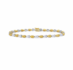 Luxurious bracelet pear-shaped fancy yellow and white diamonds in an elegant design.