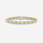 a two-tone, alternating yellow and white color diamond tennis bracelet on a white background