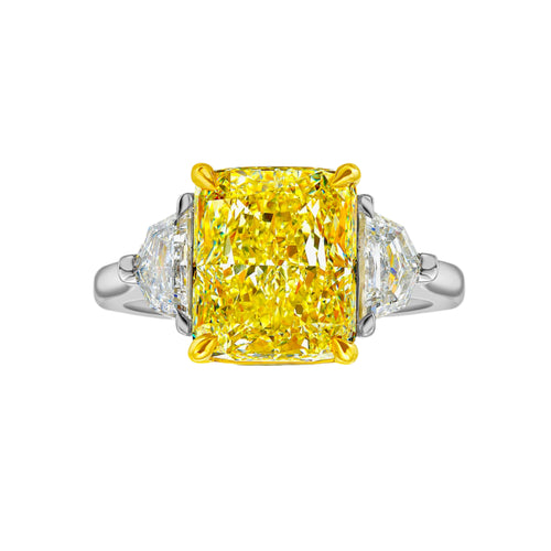 GIA certified fancy vivid yellow elongated radiant diamond engagement ring, internally flawless and stunning.