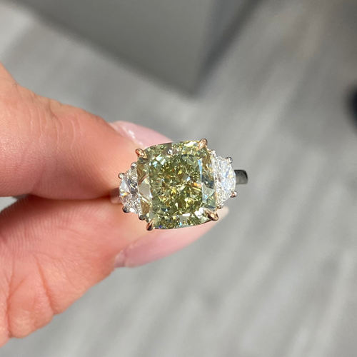 Fancy Yellow-Green cushion cut diamond engagement ring with VS2 clarity and a unique hue.