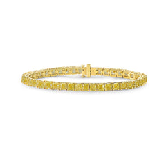 Elegant tennis bracelet featuring fancy yellow cushion-cut diamonds with exceptional clarity.