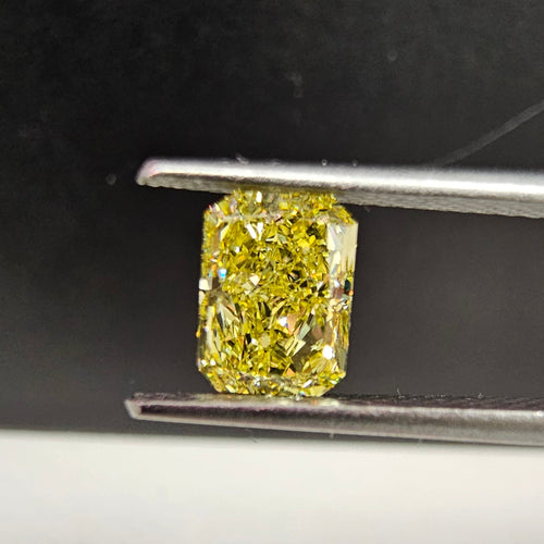 1.02 Carat Elongated Radiant Cut Diamond  GIA Certified Diamond  Fancy Intense Yellow VVS1 Clarity.