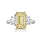 Light yellow emerald-cut diamond ring with excellent cut, VS2 clarity, and GIA certification.